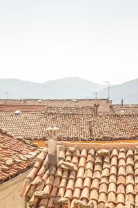 High angle view of roof tiles against sky