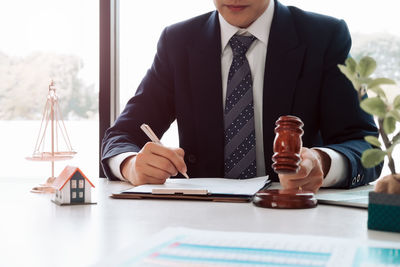 Mid section of a man holding table