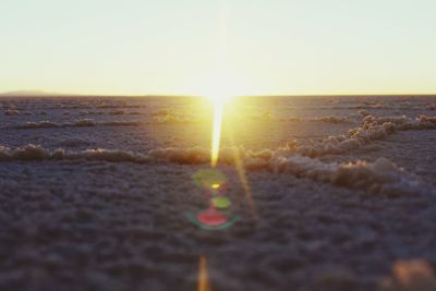 Scenic view of sea against clear sky during sunset