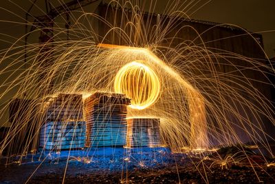 Low angle view of light trails at night