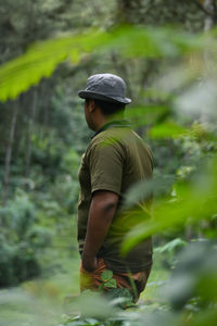 Rear view of man in forest