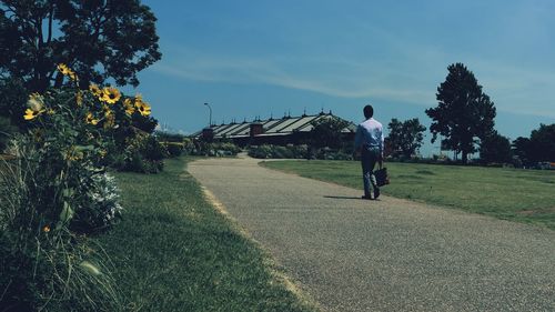 Man on field against sky