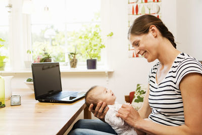 Mother and son using smart phone