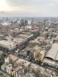 High angle view of city buildings against sky