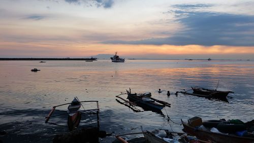 Scenic view of sea against sky at sunset