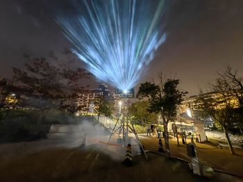People walking on street at night