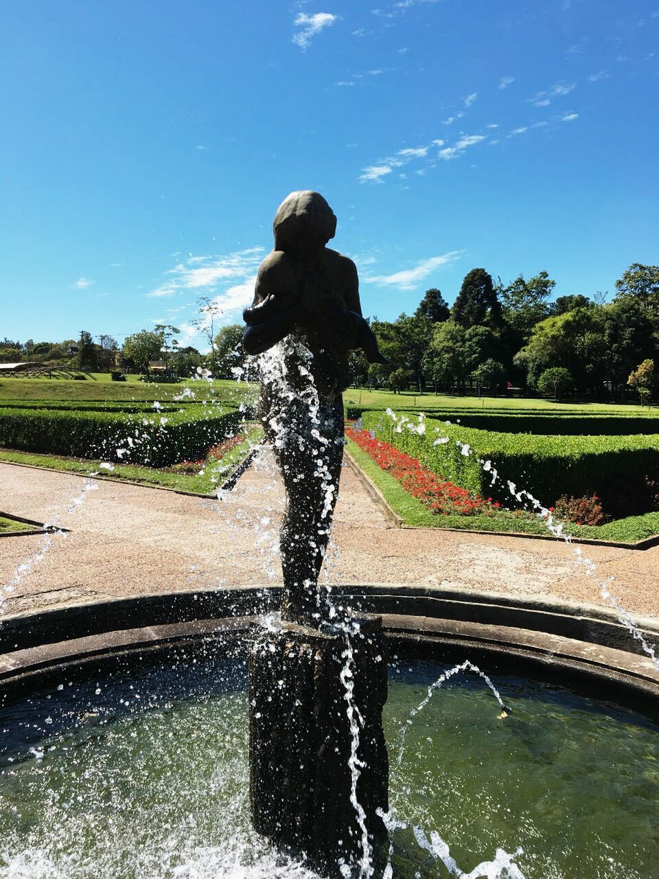 water, splashing, motion, spraying, fountain, leisure activity, real people, one person, day, refreshment, sky, outdoors, lifestyles, tree, nature, men, swimming pool, people