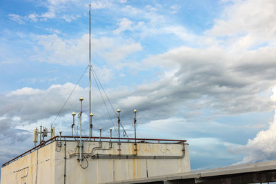 A radio mast on the roof, and solar panels on the roof