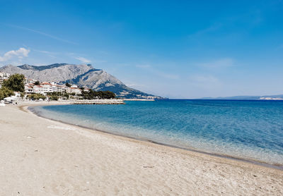 Bay with beautiful sandy beach on coast of adriatic sea near omiš in croatia.