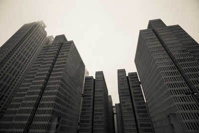 Low angle view of modern buildings against clear sky