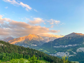 Scenic view of mountains against sky during sunset