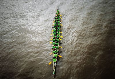 High angle view of people in boat race on river