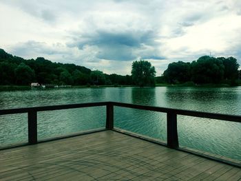 Pier over lake against sky