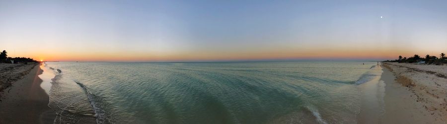 Panoramic view of sea against sky during sunset