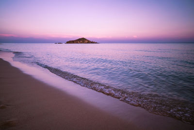 Scenic view of sea against sky at sunset