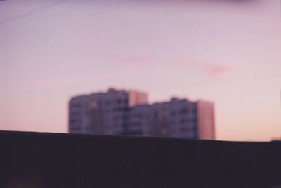 Buildings against sky during sunset