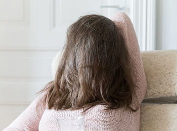 Rear view of girl at home