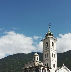 Low angle view of building against cloudy sky