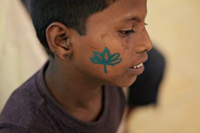 Close-up of boy with face paint