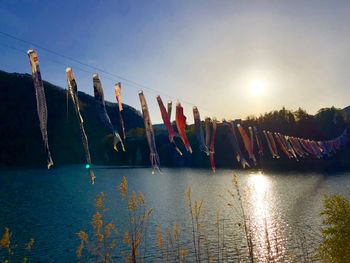 Clothes drying on rope against sky