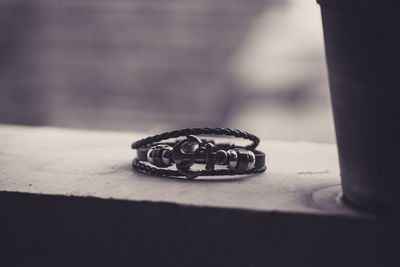 Close-up of wedding rings on table