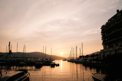 Boats moored at harbor