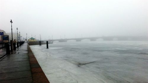 Road passing through foggy weather