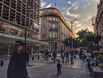 People walking on street in city