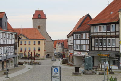 Residential buildings in city against sky