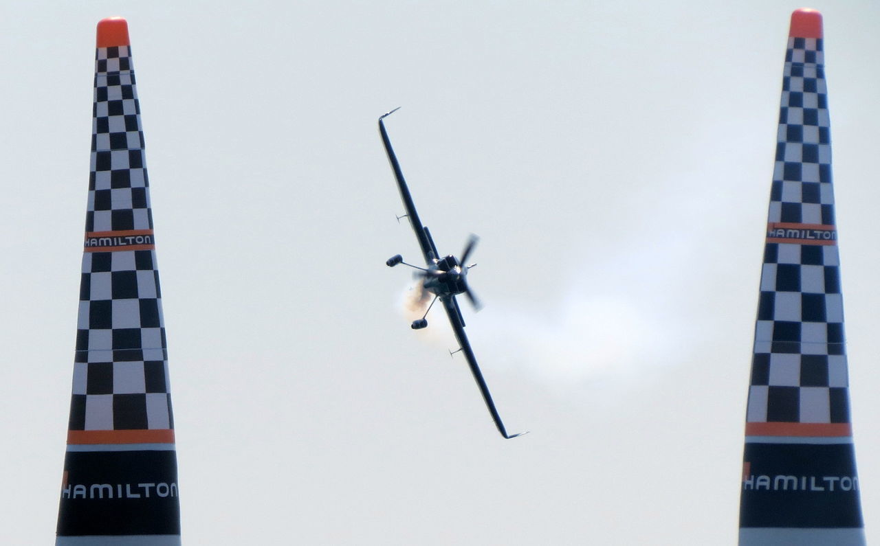 LOW ANGLE VIEW OF AIRPLANE FLYING IN SKY