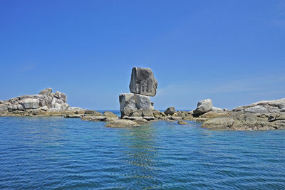 Scenic view of sea against clear blue sky