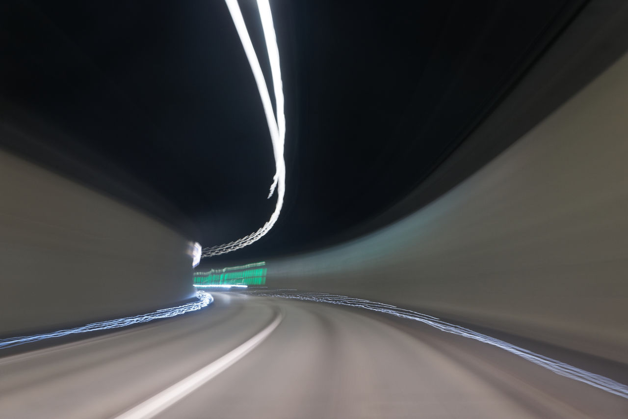 ILLUMINATED LIGHT TRAILS ON ROAD