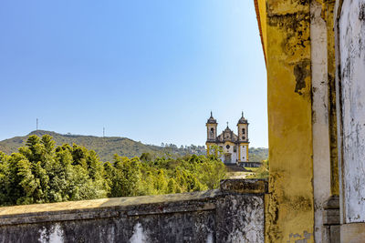 Historic church in the ouro preto, minas gerais with the city and its colonial-style