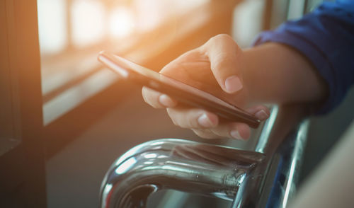 Close-up of hand holding smart phone