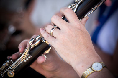 Close-up of hands playing guitar