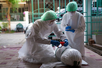 Rear view of women with umbrella