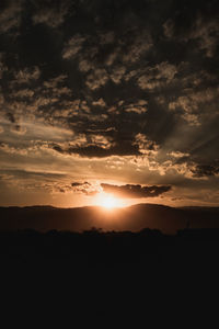 Scenic view of dramatic sky during sunset
