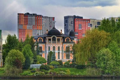 Buildings in city against sky