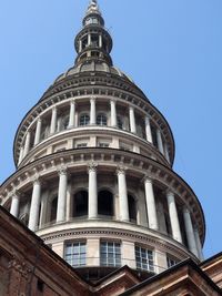 Low angle view of historical building against clear blue sky