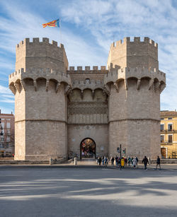 Group of people in front of historical building