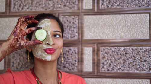 Portrait of young woman with dog