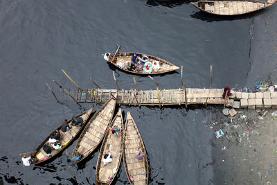 Boats moored at harbor