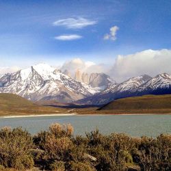 Scenic view of lake against cloudy sky