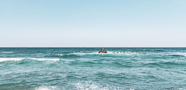 Scenic view of sea against clear sky