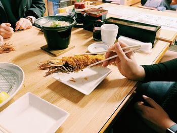 High angle view of woman preparing food on table