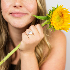 Close-up of woman holding flower