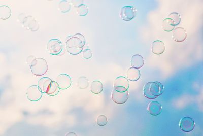 Close-up of bubbles against sky