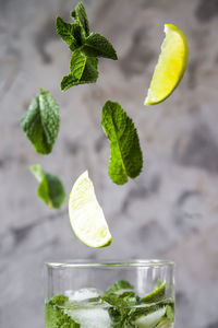 Close-up of leaves falling in lemonade