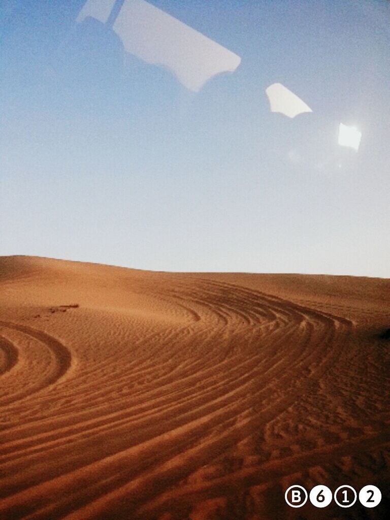 communication, text, western script, desert, landscape, sand, clear sky, number, copy space, sand dune, no people, arid climate, sunlight, horizon over land, day, tranquility, tranquil scene, blue, sky, outdoors