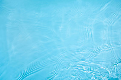 Transparent blue clear calm wave water surface texture